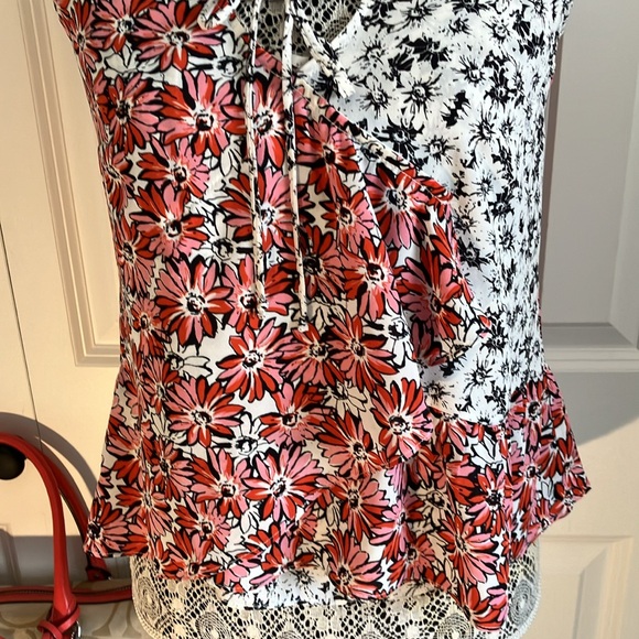Cabi Seraphina #5730 Daisy ruffled flowy top over spaghetti strapped B&W tank. - Picture 5 of 10